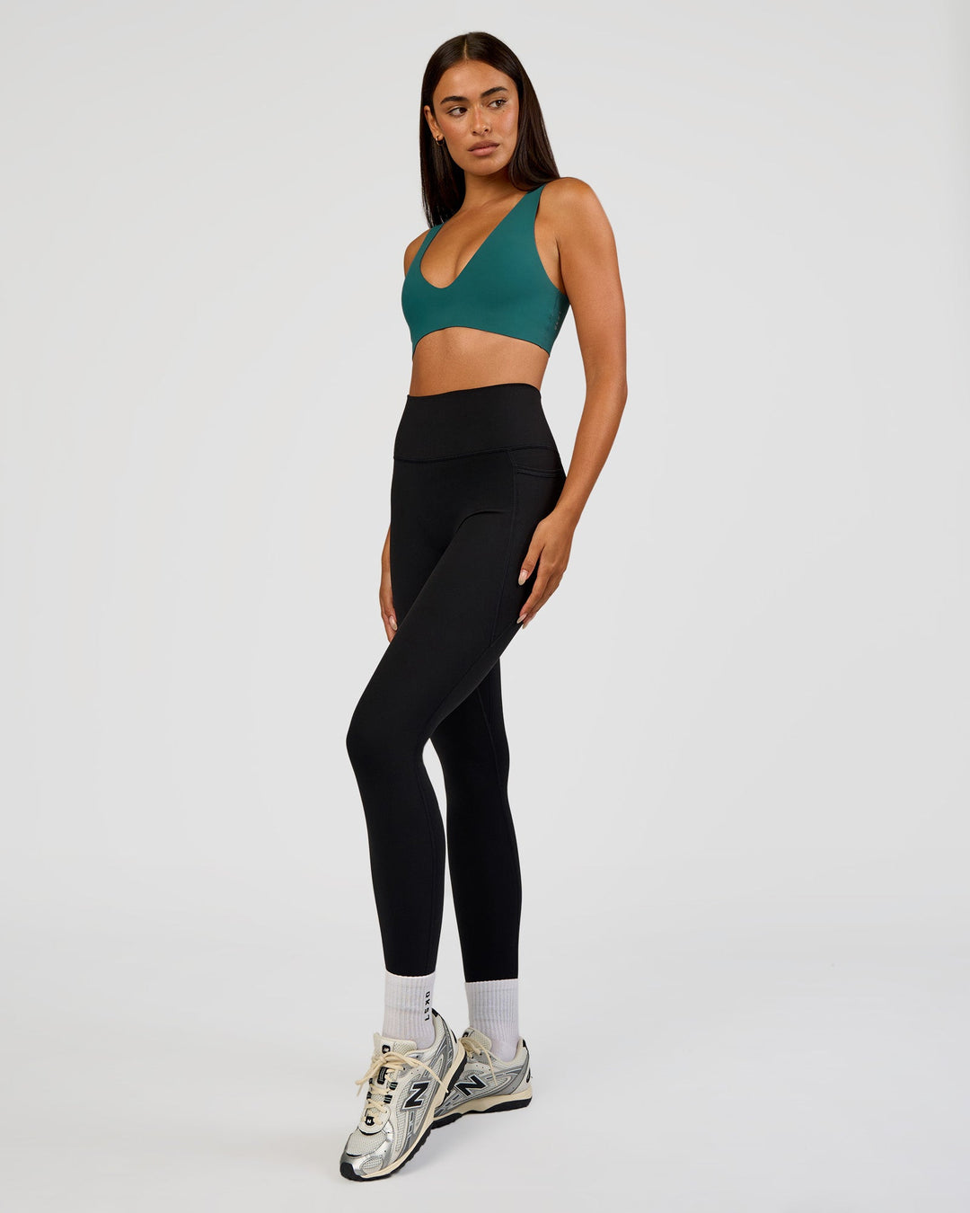 Woman wearing Bend &amp; FLX Plunge Sports Bra - Transformative Teal | Model:Ruby | Size:S