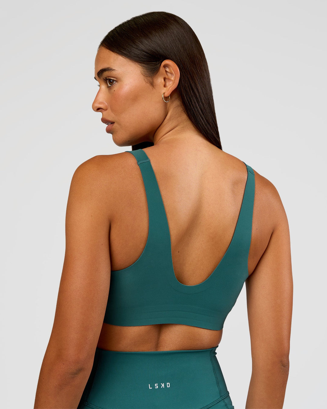 Woman wearing Bend &amp; FLX Plunge Sports Bra - Transformative Teal | Model:Ruby | Size:S