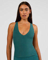 Woman wearing Bend & FLX Plunge Tank - Transformative Teal | Model:Ruby | Size:S | Thumbnail Index: 9
