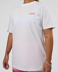 Woman wearing Break Through FLXCotton Oversized Tee - White-Pale Lilac | Model:Renee | Size:S