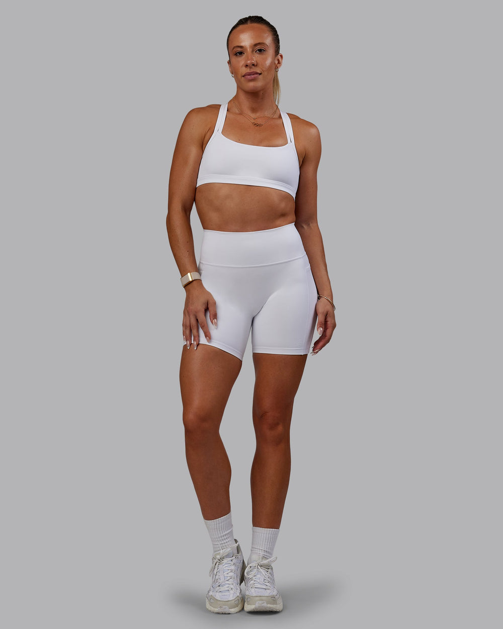 Woman wearing Bree Masters Fusion Mid Short Tights with Pockets - White