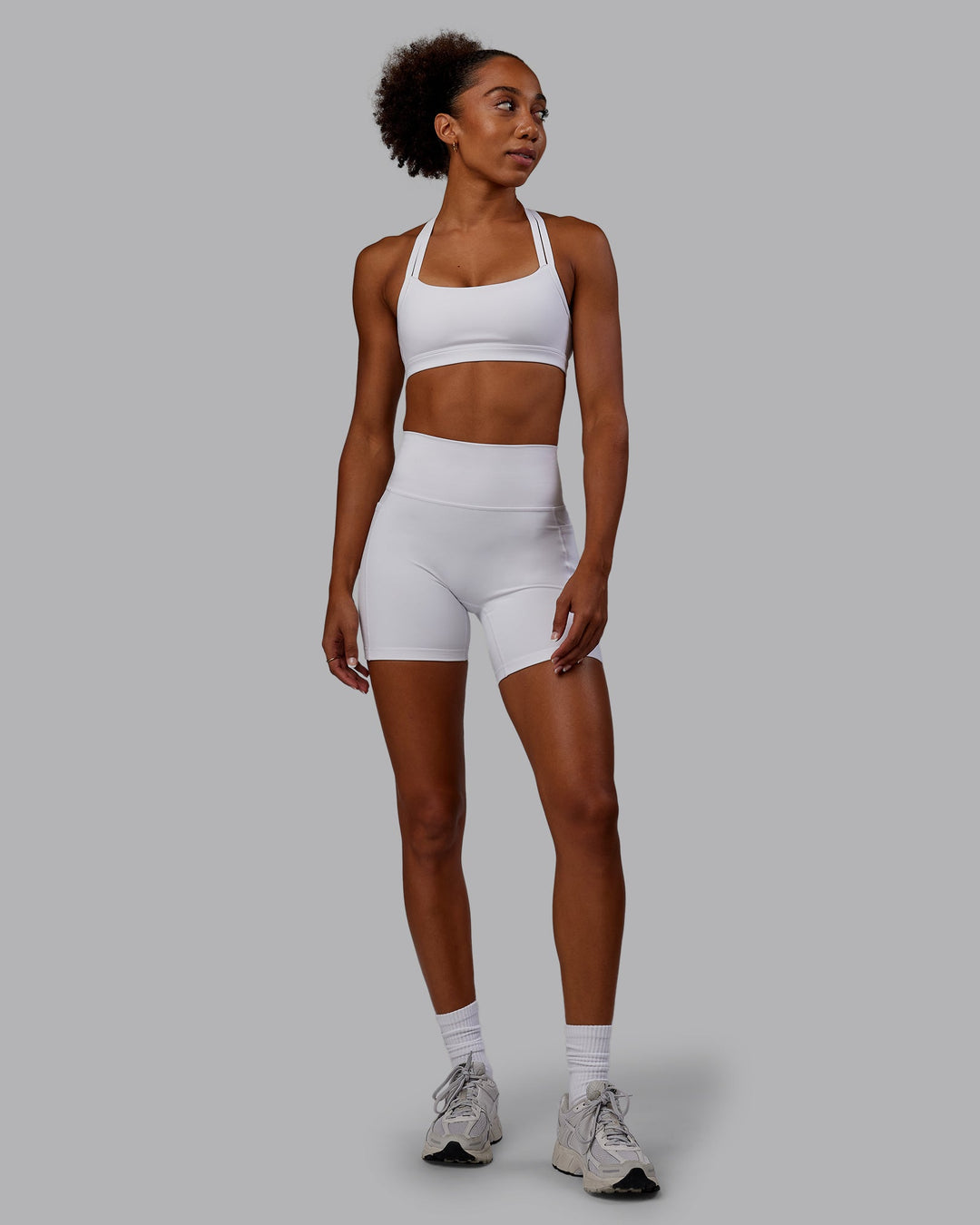 Woman wearing Bree Masters Fusion Mid Short Tights with Pockets - White