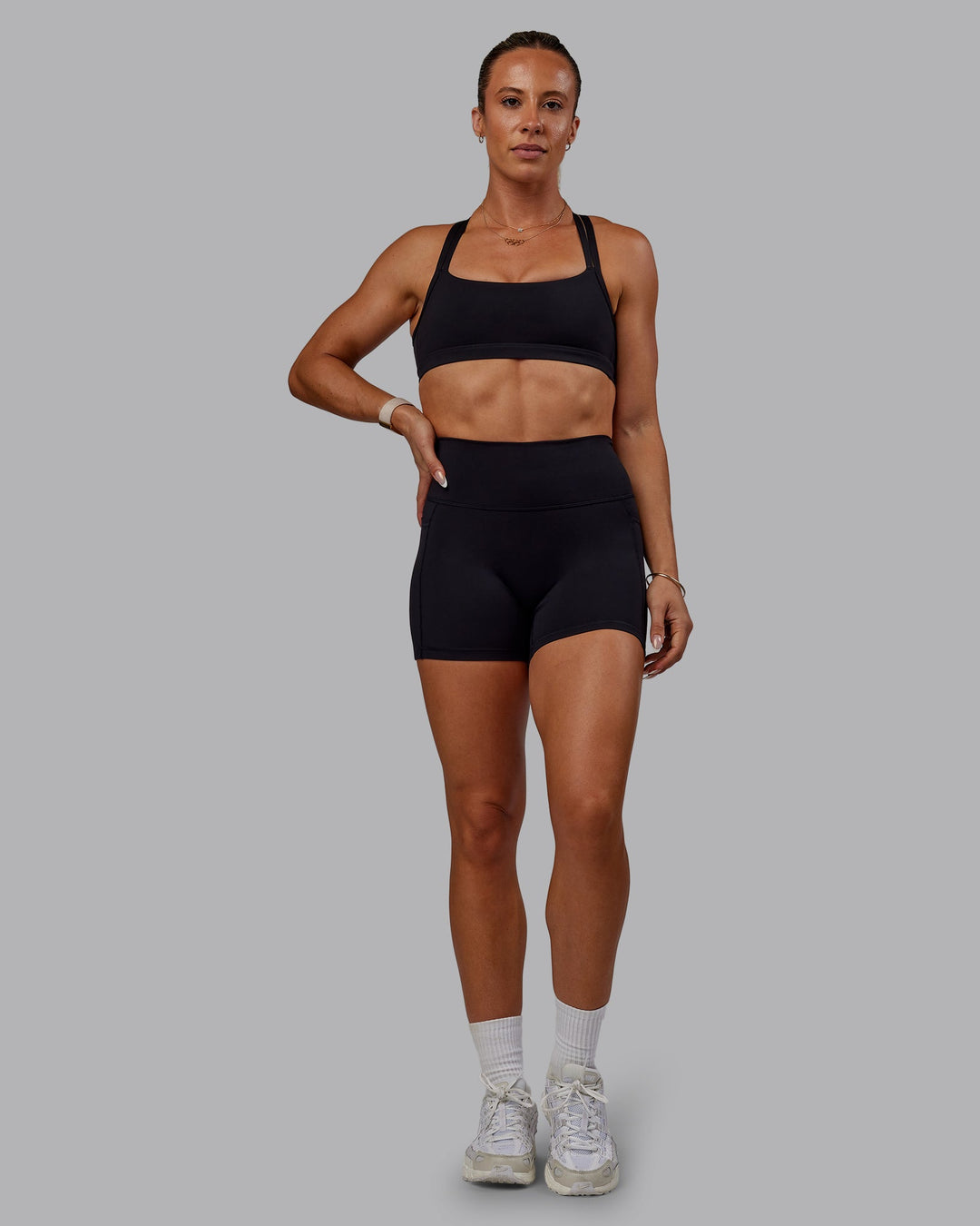 Woman wearing Bree Masters Velocity Sports Bra - Black