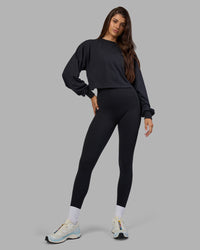 Woman wearing Breeze Open Back Sweater - Black-Black | Model:Phoebe | Size:S | Thumbnail Index: 0