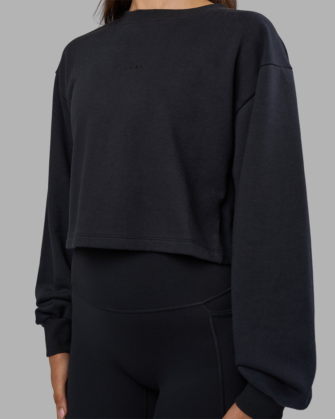 Woman wearing Breeze Open Back Sweater - Black-Black | Model:Phoebe | Size:S