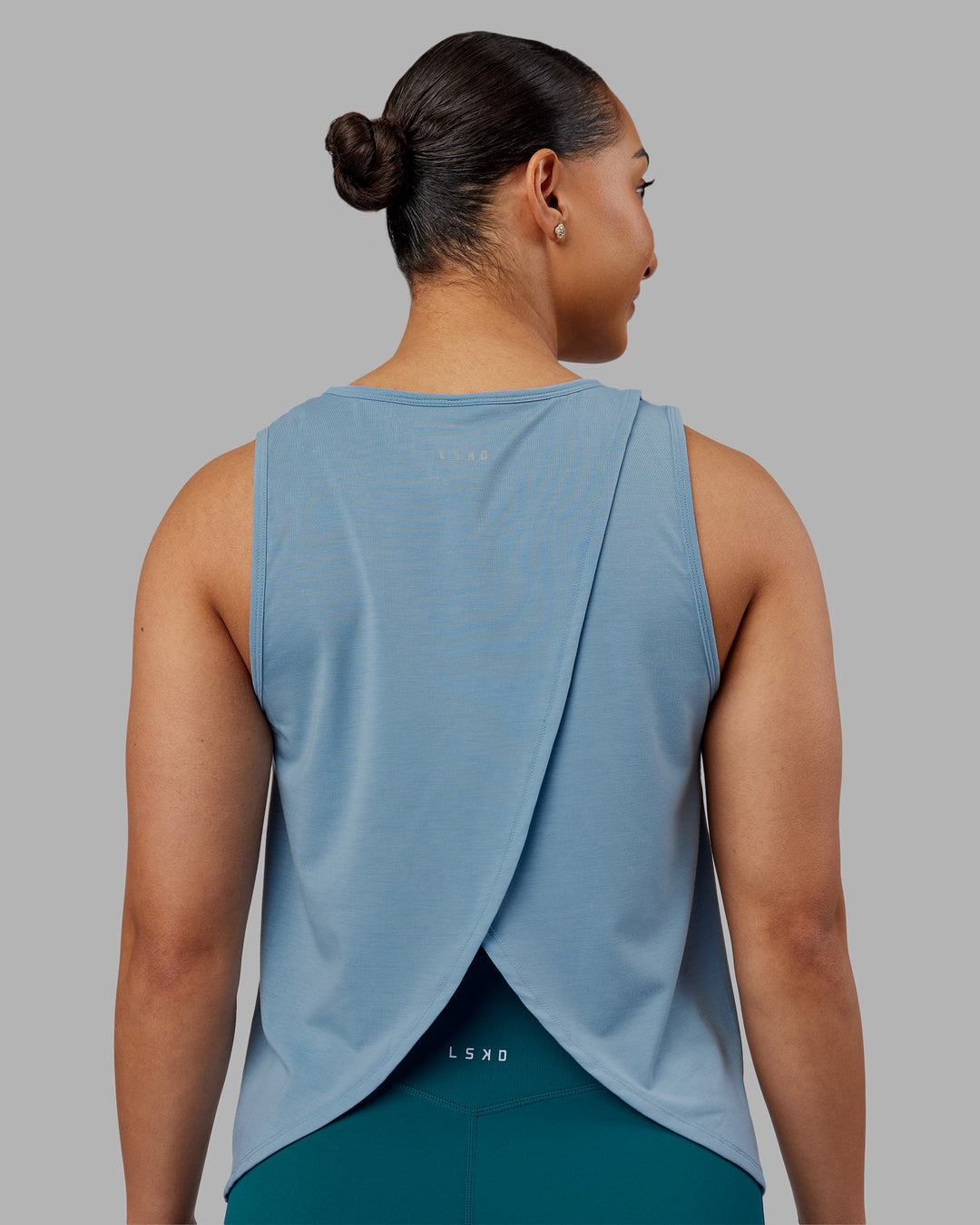 Woman wearing Breeze Training Tank - Glacier Lake | Model:Ayla | Size:S
