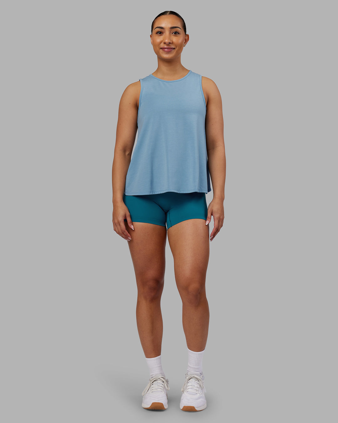 Woman wearing Breeze Training Tank - Glacier Lake | Model:Ayla | Size:S