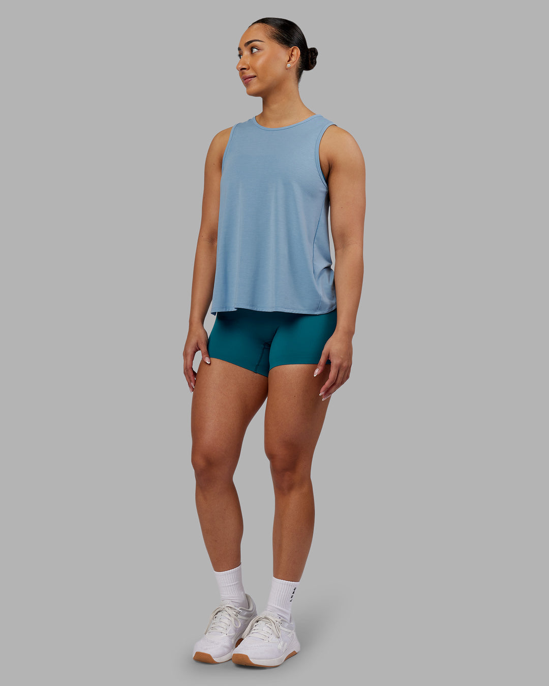 Woman wearing Breeze Training Tank - Glacier Lake | Model:Ayla | Size:S