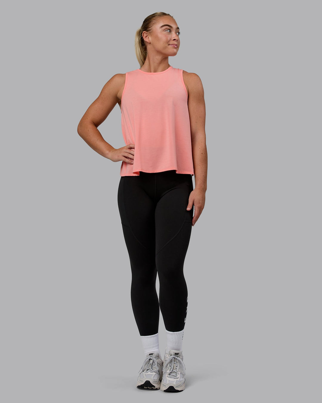 Woman wearing Breeze Training Tank - Murex Shell