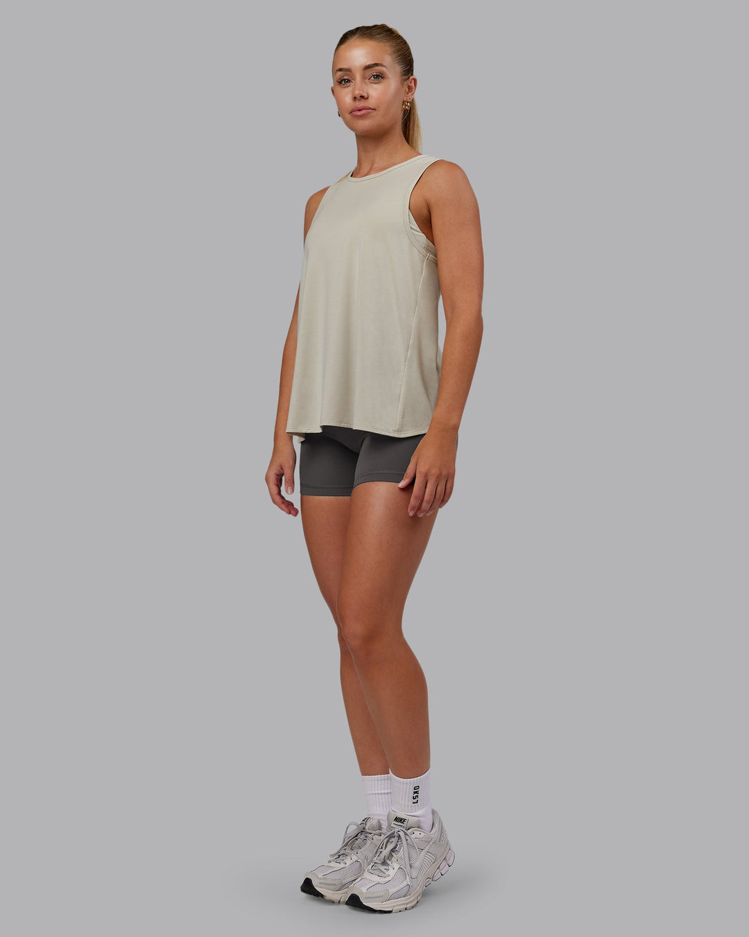 Woman wearing Breeze Training Tank - Shale Beige | Model:Hannah | Size:S