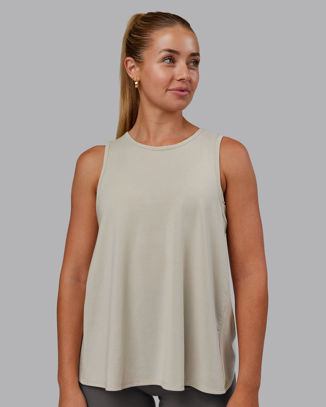 Woman wearing Breeze Training Tank - Shale Beige | Model:Hannah | Size:S