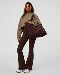 Model wearing CF Fold Over High-Rise Flared Legging - Hot Chocolate | Model:Jordan | Size:S