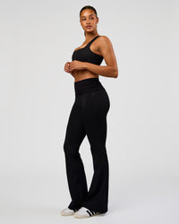 Woman wearing CF Fold Over High-Rise Flared Legging Tall - Black | Model:Rosie | Size:S