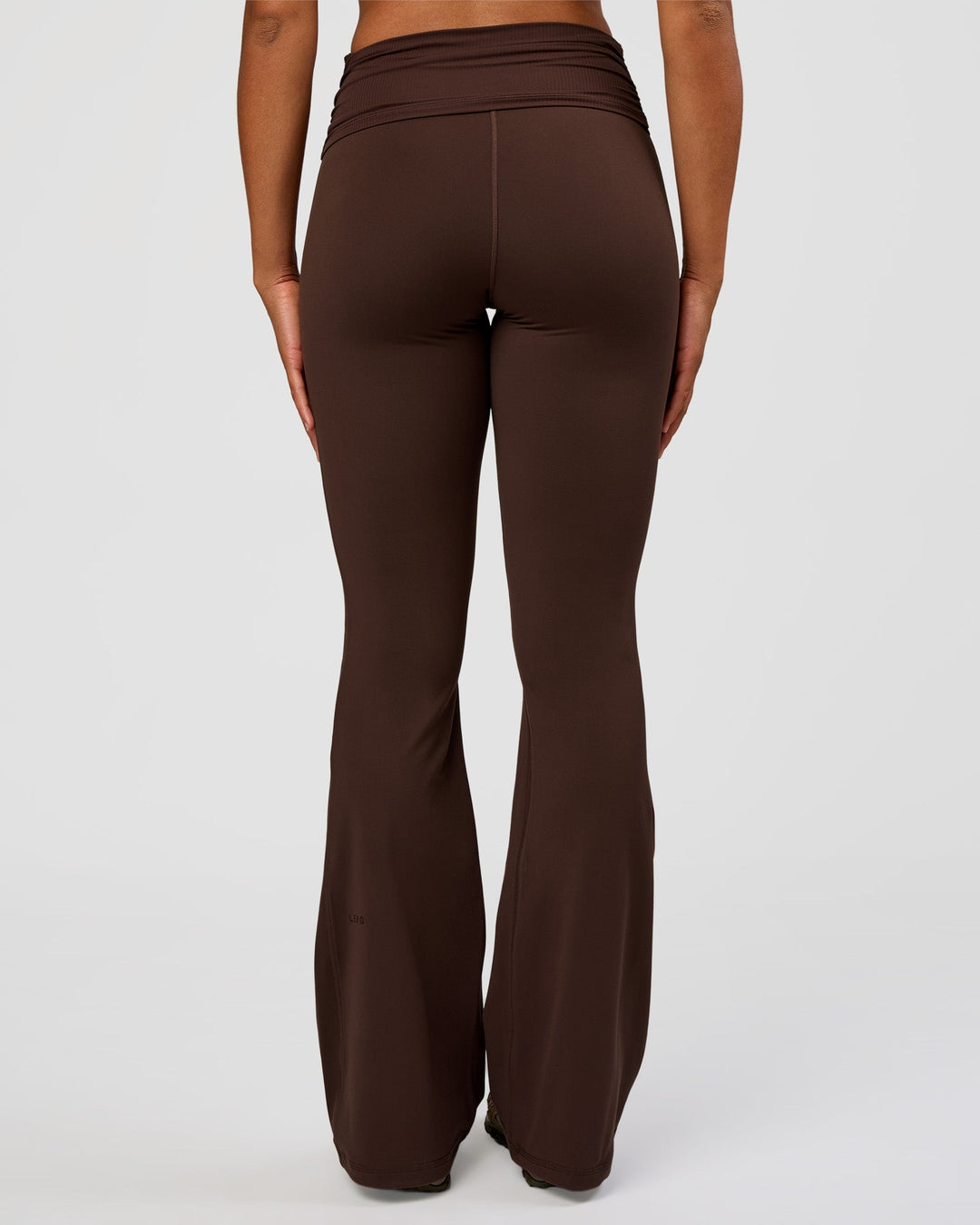 Woman wearing CF Fold Over High-Rise Flared Legging Tall - Hot Chocolate | Model:Rosie | Size:S