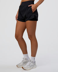 Woman wearing Challenger 3" Lined Performance Short - Black | Model:Amity | Size:S