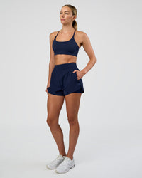 Woman wearing Challenger 3" Lined Performance Short - Future Navy | Model:Evie | Size:S