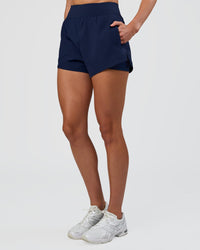 Woman wearing Challenger 3" Lined Performance Short - Future Navy | Model:Evie | Size:S