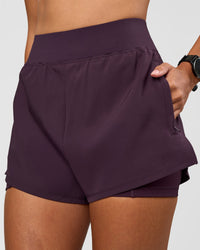 Woman wearing Challenger 3" Lined Performance Short - Midnight Plum | Model:Rhiley | Size:S
