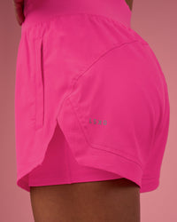 Woman wearing Challenger 3" Lined Performance Short - Ultra Pink | Model:Hannah | Size:S