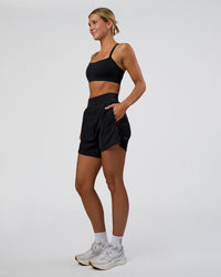 Woman wearing Challenger 5" Lined Performance Short - Black | Model:Amity | Size:S