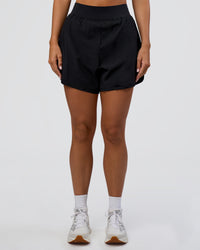 Woman wearing Challenger 5" Lined Performance Short - Black | Model:Amity | Size:S