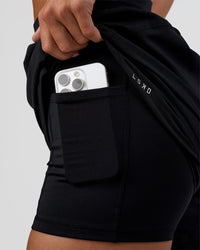 Woman wearing Challenger 5" Lined Performance Short - Black | Model:Amity | Size:S