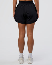 Woman wearing Challenger 5" Lined Performance Short - Black | Model:Amity | Size:S