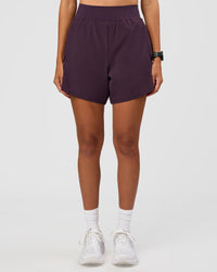 Woman wearing Challenger 5" Lined Performance Short - Midnight Plum | Model:Rhiley | Size:S