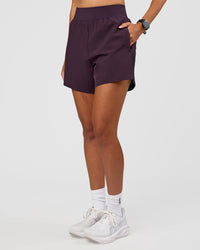 Woman wearing Challenger 5" Lined Performance Short - Midnight Plum | Model:Rhiley | Size:S