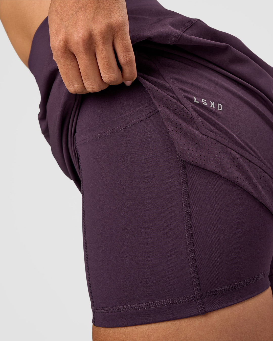 Woman wearing Challenger 5" Lined Performance Short - Midnight Plum | Model:Rhiley | Size:S