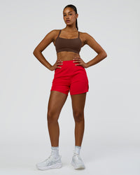 Woman wearing Challenger 5" Lined Performance Short - Scarlet | Model:Rosie | Size:S