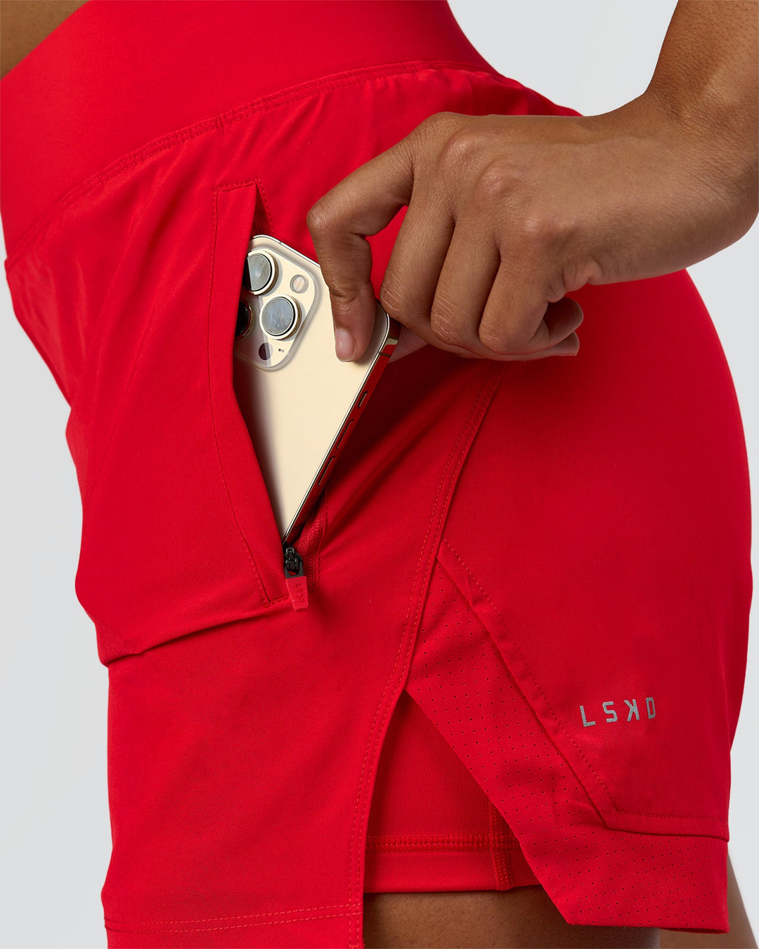 Woman wearing Challenger 5" Lined Performance Short - Scarlet | Model:Rosie | Size:S