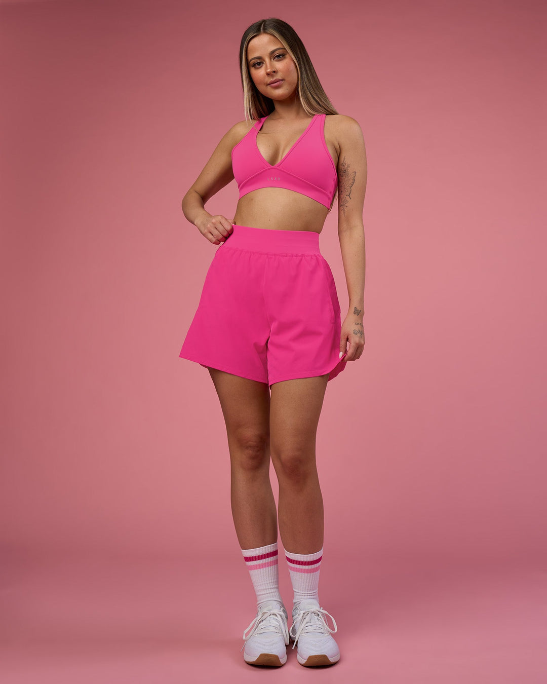 Woman wearing Challenger 5&quot; Lined Performance Short - Ultra Pink | Model:Tianah | Size:S