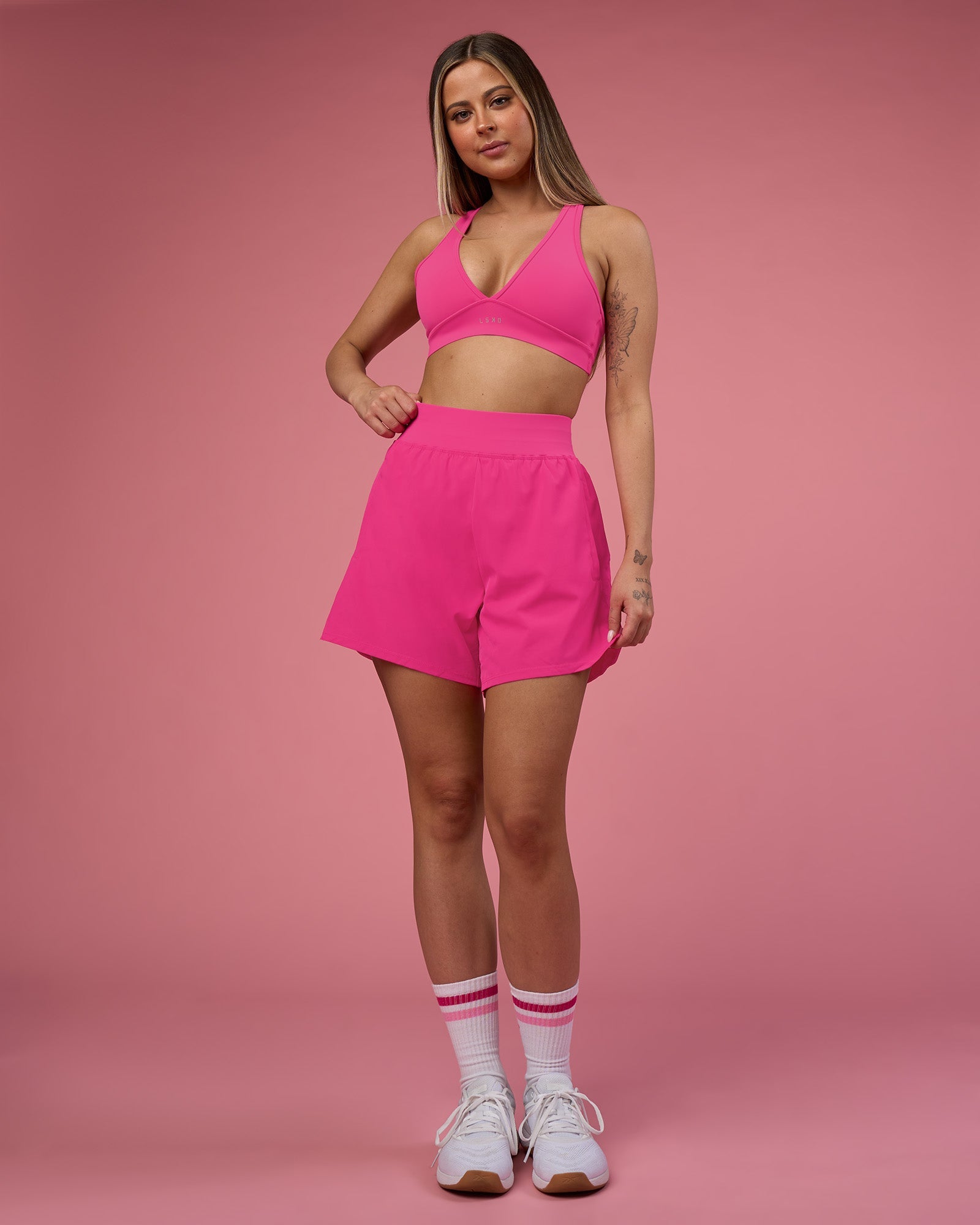 Woman wearing Challenger 5" Lined Performance Short - Ultra Pink | Model:Tianah | Size:S