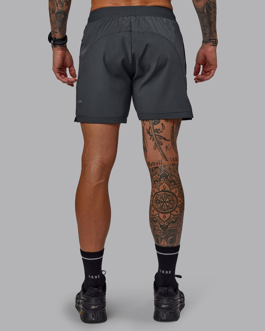 Man wearing Challenger 6&quot; Performance Short in Dark Storm | Size:S