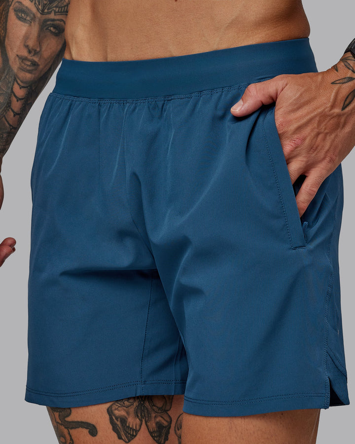 Man wearing Challenger 6&quot; Performance Short in Indigo | Size:S
