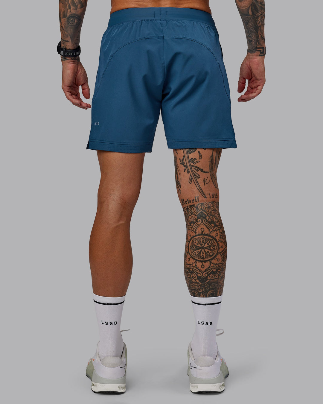 Man wearing Challenger 6&quot; Performance Short in Indigo | Size:S