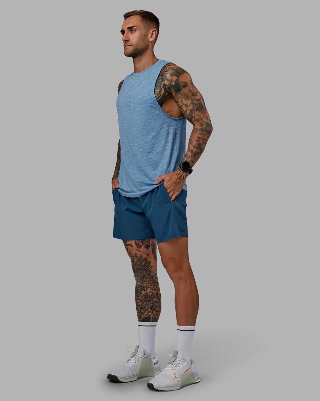 Man wearing Challenger 6&quot; Performance Short in Indigo | Size:S