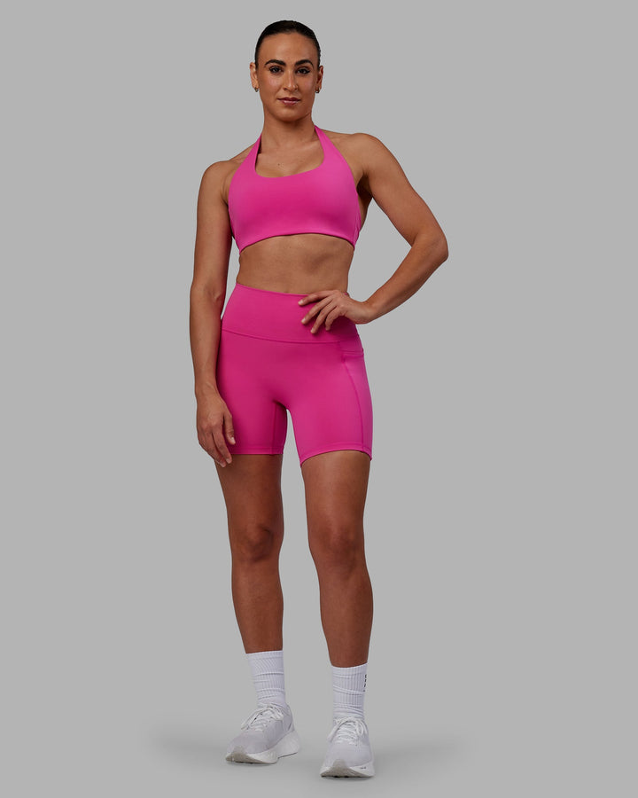 Woman wearing Challenger Sports Bra - Fuchsia Pink
