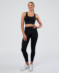 Woman wearing Circuit Longline Sports Bra - Black | Model:Evie | Size:S | Thumbnail Index: 2