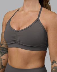 Woman wearing Clarity Sports Bra - Dark Storm | Model:Robyn | Size:S
