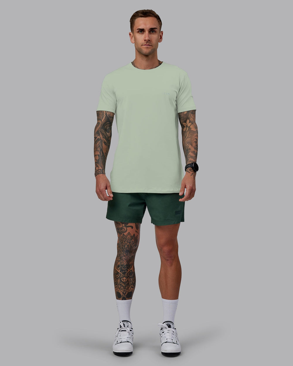 Man wearing Daily 5" Shorts - Cilantro