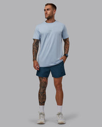 Man wearing Daily 5" Shorts - Indigo