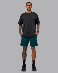 Man wearing Daily 7" Shorts - Dark Moss