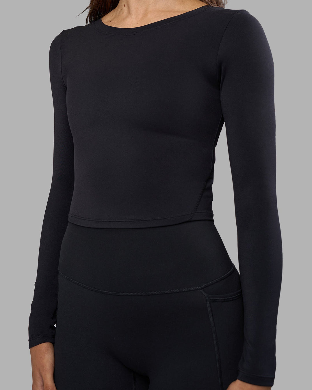 Woman wearing Effortless Long Sleeve Top - Black | Model:Phoebe | Size:S