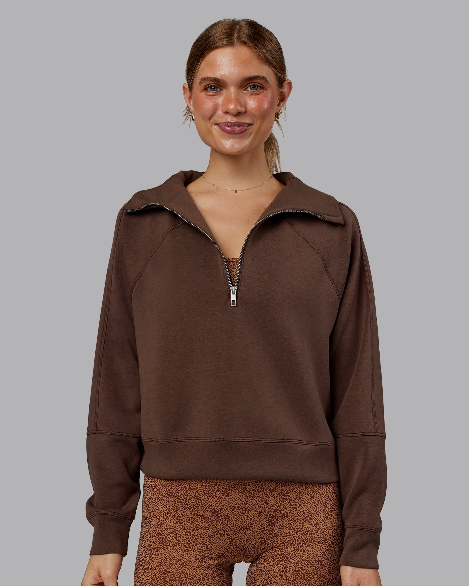 Woman wearing Elevate SoftTouch 1/2 Zip Sweater - Chocolate Martini | Model:Emilie | Size:S