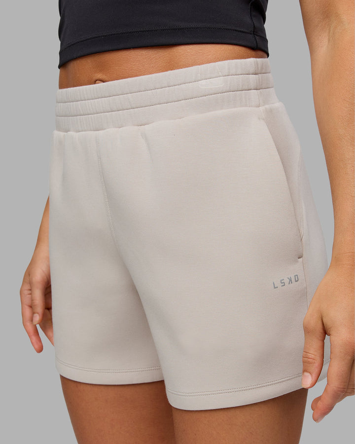 Woman wearing Elevate SoftTouch 4&quot; Short in Shale Beige | Size:S
