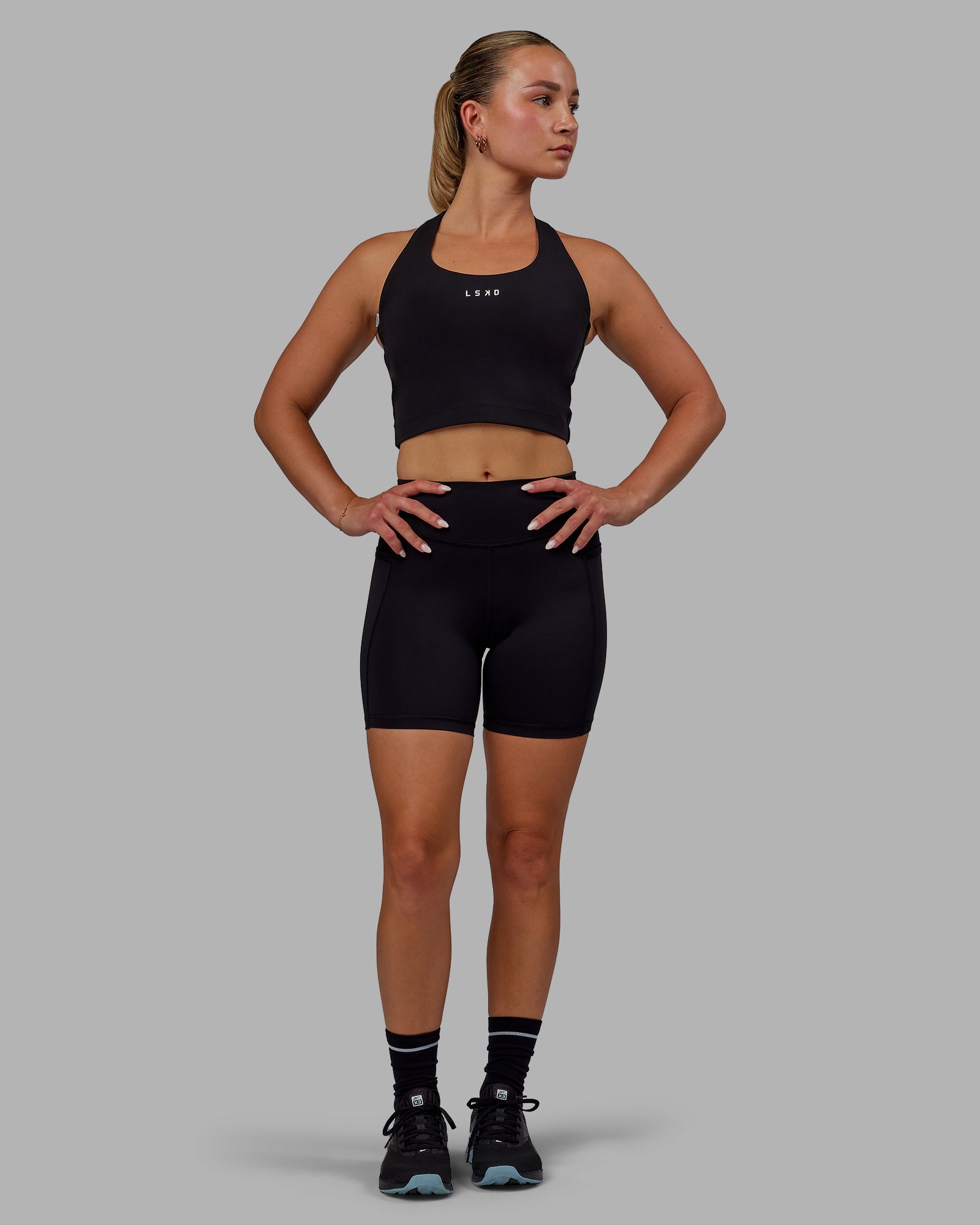 Woman wearing Elite High-Rise 6" Short Pockets - Black