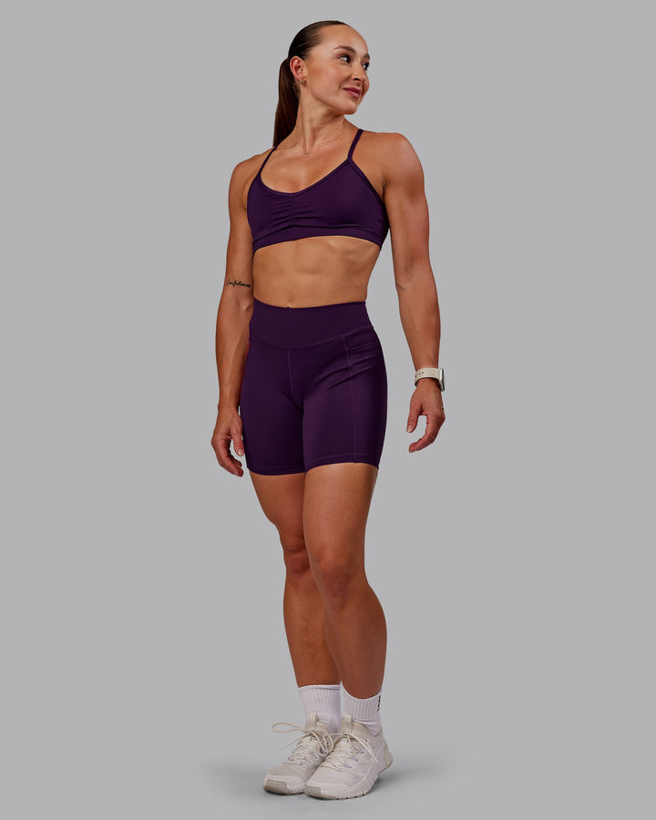 Woman wearing Elite Mid Short Legging in Deep Purple | Size:S
