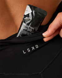 Woman wearing Elite Run High-Rise 5" Short Pockets - Black | Model:Emelia | Size:S